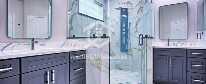 Modern bathroom remodel in Sugar Land featuring walk-in shower, floating vanity, and freestanding tub.